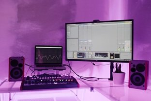 A digital audio editing workspace displaying side-by-side spectral waveform analysis of compressed MP3 and uncompressed WAV audio files.