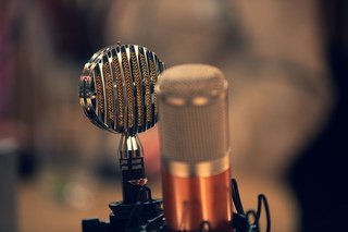 Two studio microphones used for recording vocals and developing song ideas.